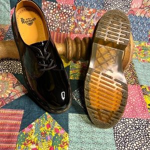 Dr. Martens lo-cut  Black patient leather shoe.        Size 7. Brand New.